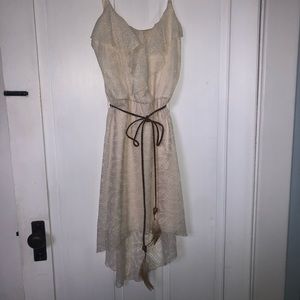 Beige dress with adorable leather feather tie
